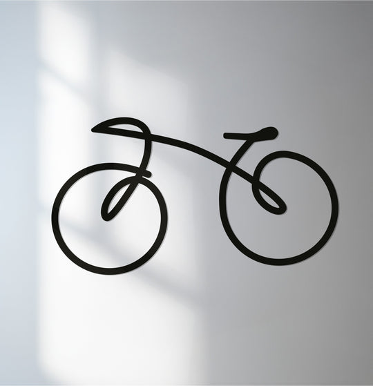 Soft, diffused lighting on the background accentuates the minimal bicycle metal artwork, creating a modern and stylish focal point.