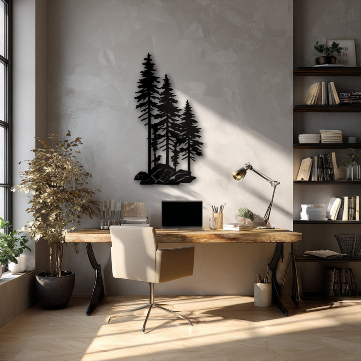 The image showcases low color saturation with muted tones highlighting the striking black pine trees metal wall decor above a rustic wooden desk.