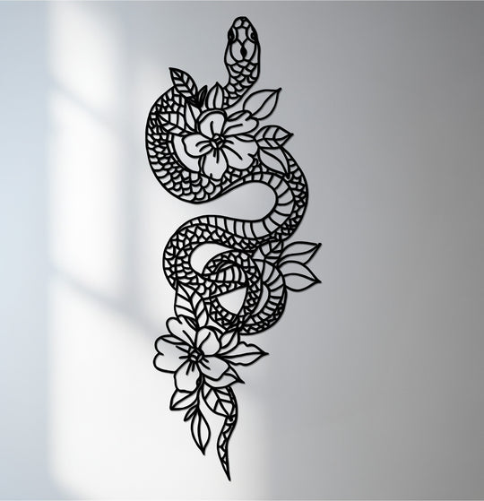 Deep shadows define the intricacies of this metal decoration wall art featuring a coiled snake entwined with delicate floral elements.