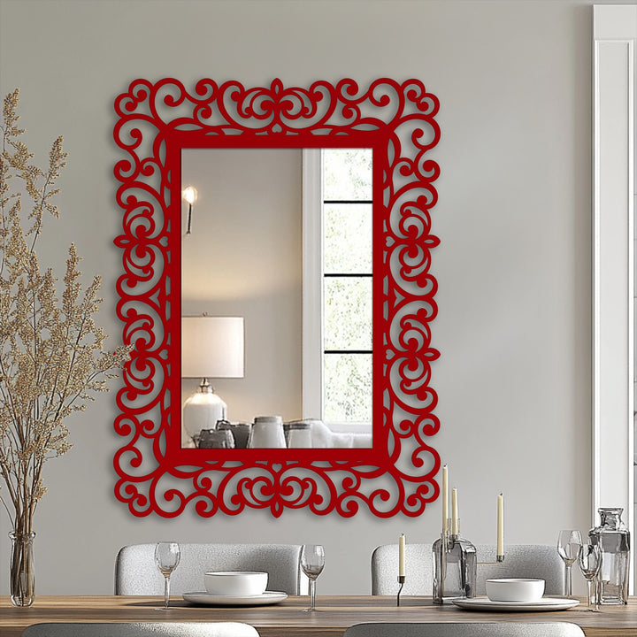 Focal point shows an elegant bathroom mirror, a rectangular mirror featuring an ornamental red frame with baroque scroll detail, making it a unique metal wall art piece.