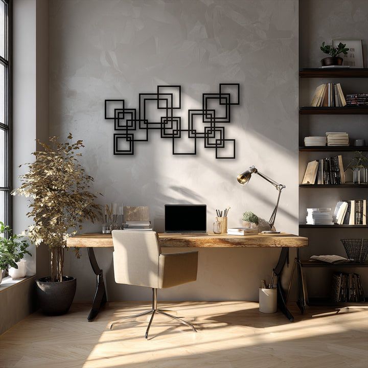 Warm gray room featuring modern geometric interlocking squares metal art for wall above a rustic wooden desk in a sunlit home office.