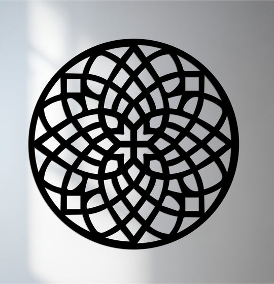 Warm lighting highlights the intricate design of the black Celtic Harmony Mandala round metal wall art, adding dimension to this unique metal wall art piece.