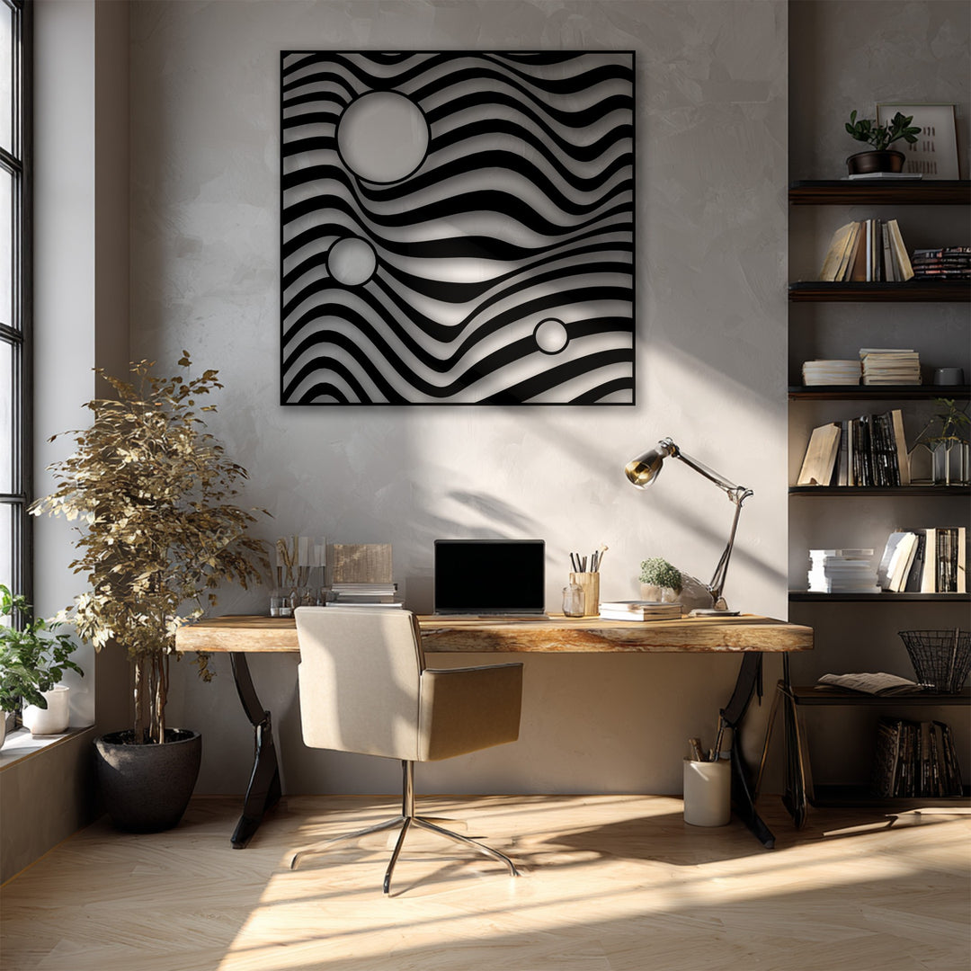 Light grey and black dominate this modern abstract wave geometry metal wall decor hanging above a wooden desk.