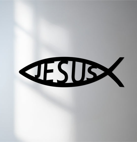 Subtle light and shadow accentuate this decorative metal art Jesus fish, creating a compelling contrast on the stark white surface.