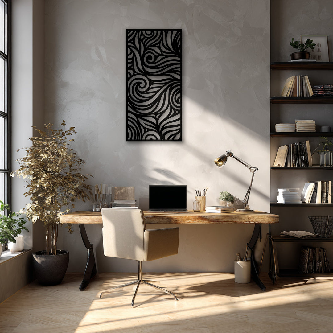 The brightest area illuminates the intricate abstract flow pattern decorative metal art and a warmly lit wooden floor.