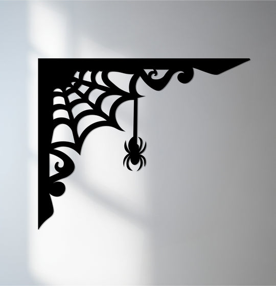 Shadows transition from dark to light across the Spider Web Corner decorative metal art, accentuating the Gothic design with subtle color gradations.