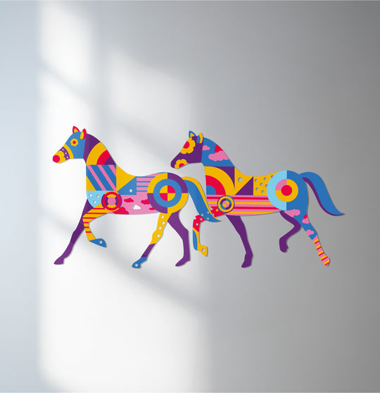 Warm light highlights this colorful geometric horses metal artwork, a unique home decor piece displaying cool and warm shades in a striking, modern design.