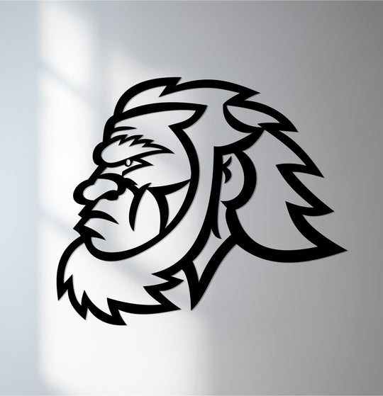 Soft light graces the background around this striking lion head silhouette, a modern piece of metal wall decor symbolizing power and strength.