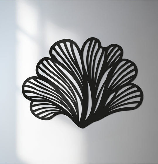 High color contrast defines this modern black botanical decor, showcasing abstract leaf fan's unique metal wall art with striking clarity against the background.