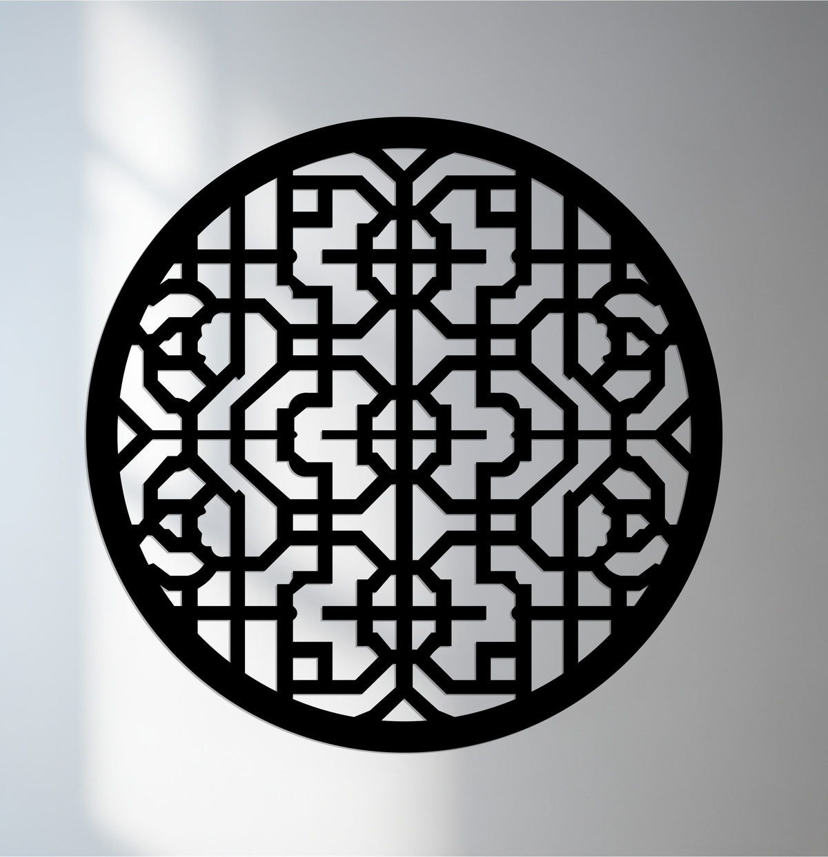 The unique metal wall art exhibits a sleek black finish, accentuating the intricate geometric mandala pattern in this round metal wall décor piece.