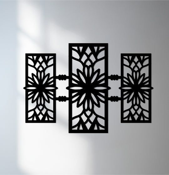 High color contrast highlights the geometric metal wall art, where laser-cut floral patterns offer a unique metal wall art design in three symmetrical panels.