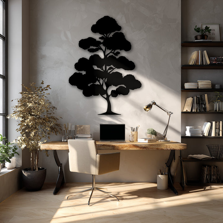 A bold black silhouette of Zen Bonsai Tree Metal Wall Art is the central decoration wall art on a textured light gray wall, catching sunlight.