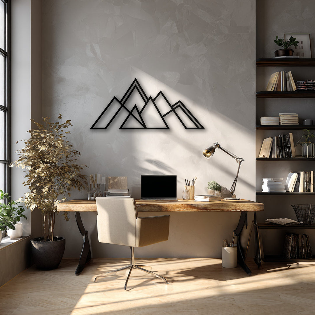 The subdued color saturation highlights the crisp black lines of the Minimal Peaks geometric mountain decorative metal art, creating a tranquil office aesthetic.