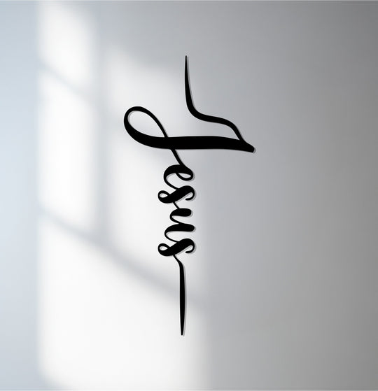 Showcasing the decorative metal art of the 'Jesus' word cross, the design features beautifully flowing, organic forms that evoke a sense of grace.