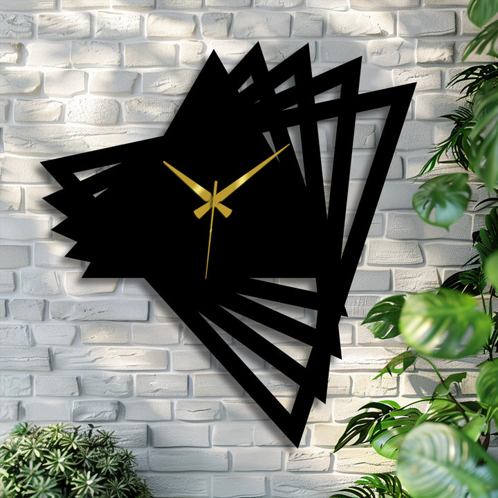 The darkest area defines this abstract origami metal wall clock, a piece of metal art for wall and home decor that brings bold, geometric design to a modern space.