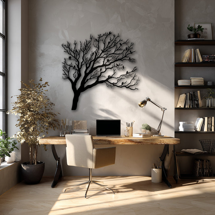 A textured light gray wall with a subtle stucco-like finish serves as a muted background for the unique metal wall art of birds on tree branches.