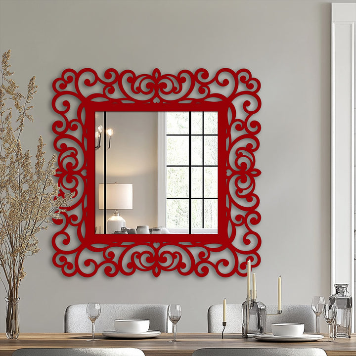 Brightest part of the red ornate wall mirror reflects a window and a lamp, bringing artistic flair and serving as practical mirror for wall decor.