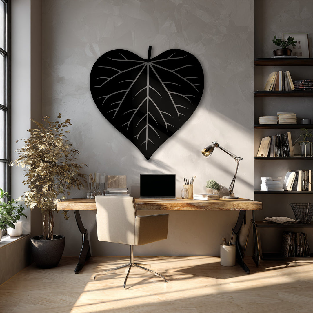 The exceptional material quality of this unique metal wall art is evident in the finely crafted leaf silhouette, adding a modern aesthetic.