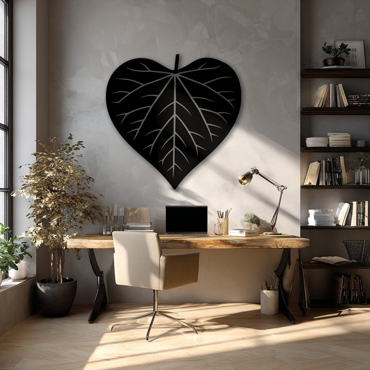 The exceptional material quality of this unique metal wall art is evident in the finely crafted leaf silhouette, adding a modern aesthetic.