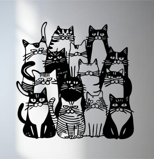 Overlapping silhouettes create depth and layers in this unique metal wall art of a cat family, a modern design with a playful artistic style.