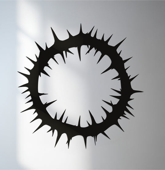 Entwined, thorn-like organic forms shape this metal wall art, creating a striking and symbolic piece of decoration wall art for distinctive spaces.