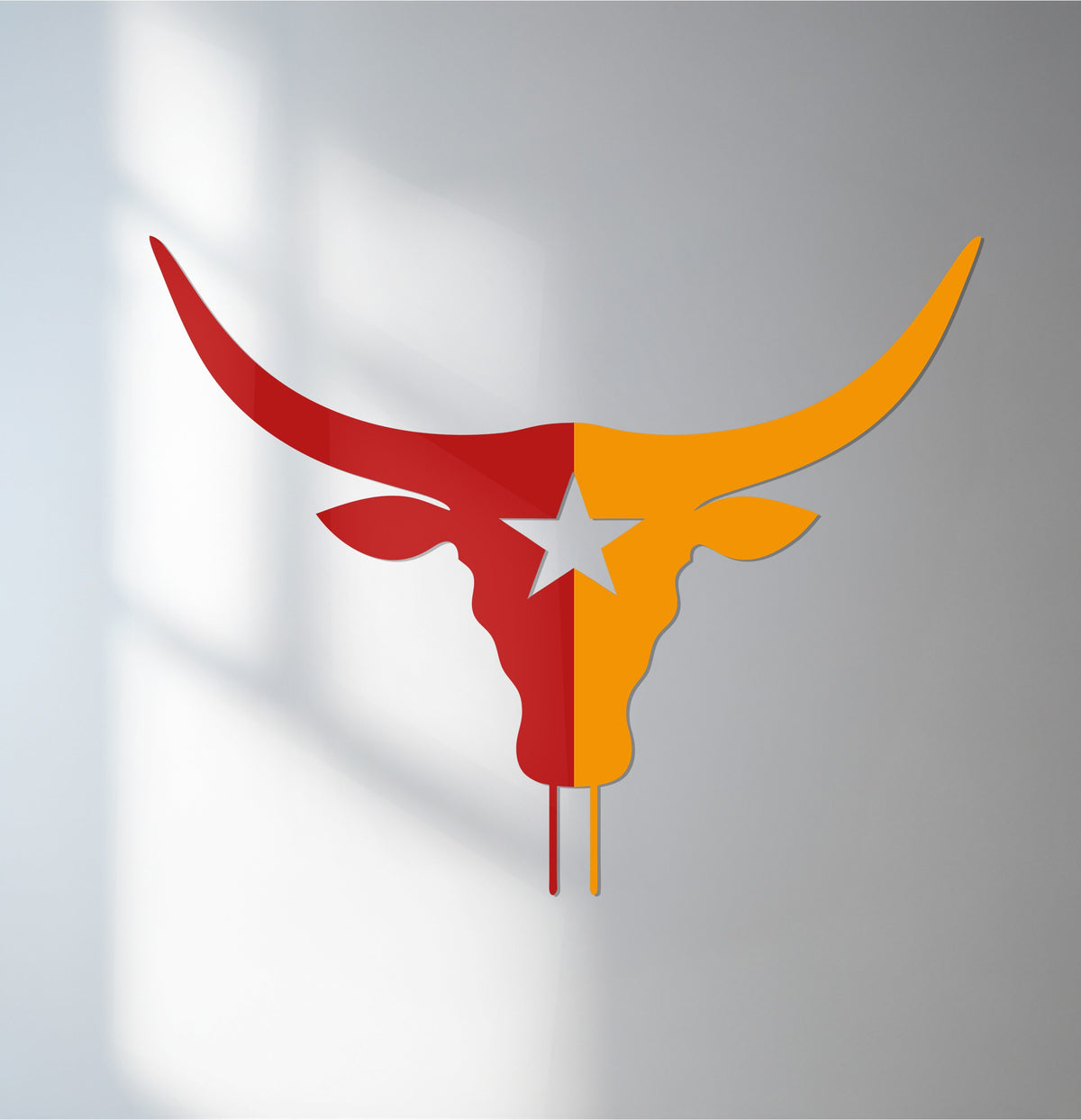Horizontal Texas Longhorn metal art for wall showcases a bull skull shape, divided with a central star in a vibrant red and gold color scheme.
