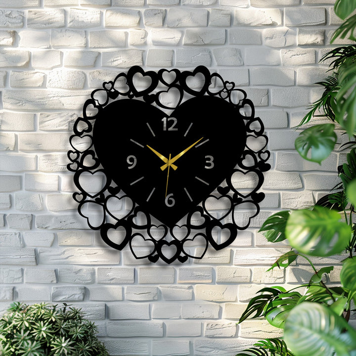The negative space of the white brick wall beautifully outlines the romantic heart frame metal artwork, emphasizing its love-inspired design.