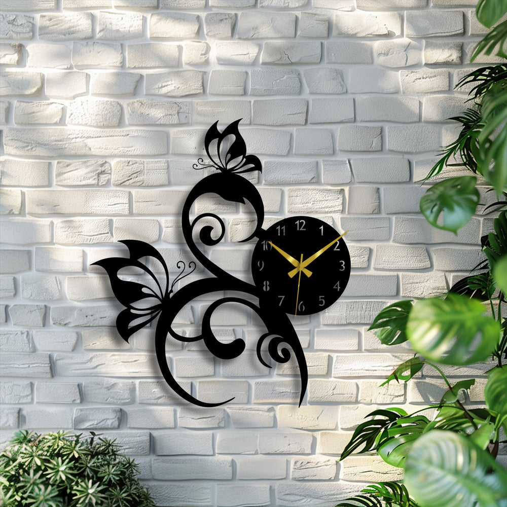 The raw, textured white brick wall provides a striking backdrop for the smooth, elegant butterfly vine metal artwork clock.