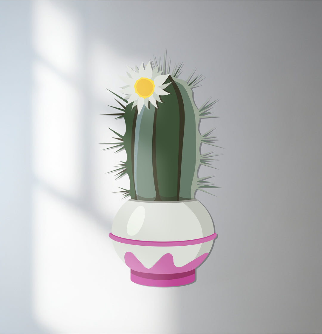 Warm, natural lighting highlights the green and pink hues of this botanical decorative metal art featuring a blossom crown cactus in a pot.