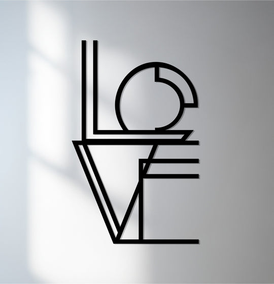 The light wall provides a clean backdrop to showcase the unique metal wall art 'LOVE' typography piece, creating depth.