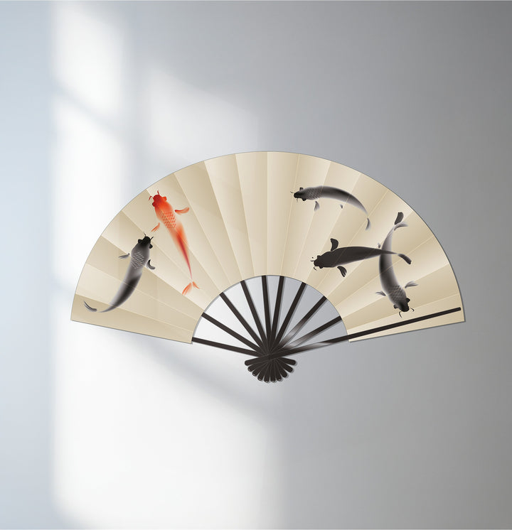 Negative space highlights the fish design on this unique metal wall art, an elegant Japanese-inspired fan offering a balanced composition.