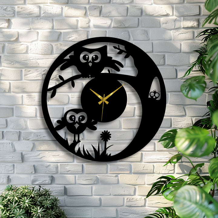 Softest light highlights the cute owl decorative metal art on this playful wall clock, casting a gentle glow on the charming design.