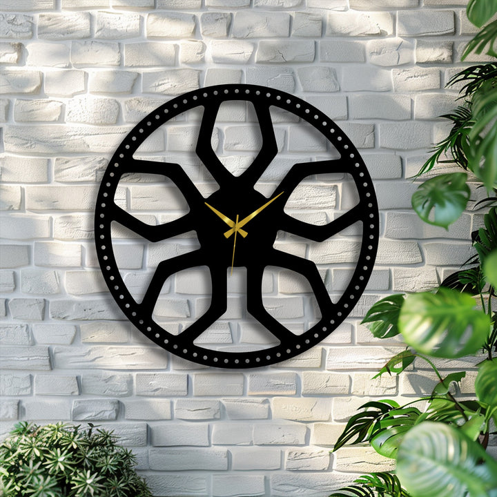 The striking abstract radial pattern metal wall clock dominates the white brick wall, serving as a captivating piece of decoration wall art.