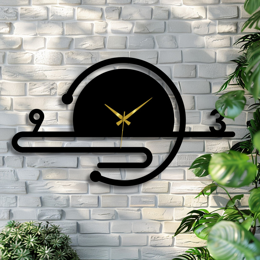 Sharp color contrast defines the minimalist orbit line metal wall clock, a striking piece of decorative metal art, with gold hands against the black geometric design.