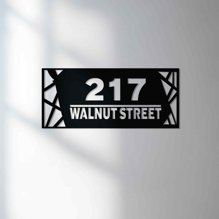 Modern metal address sign with street name