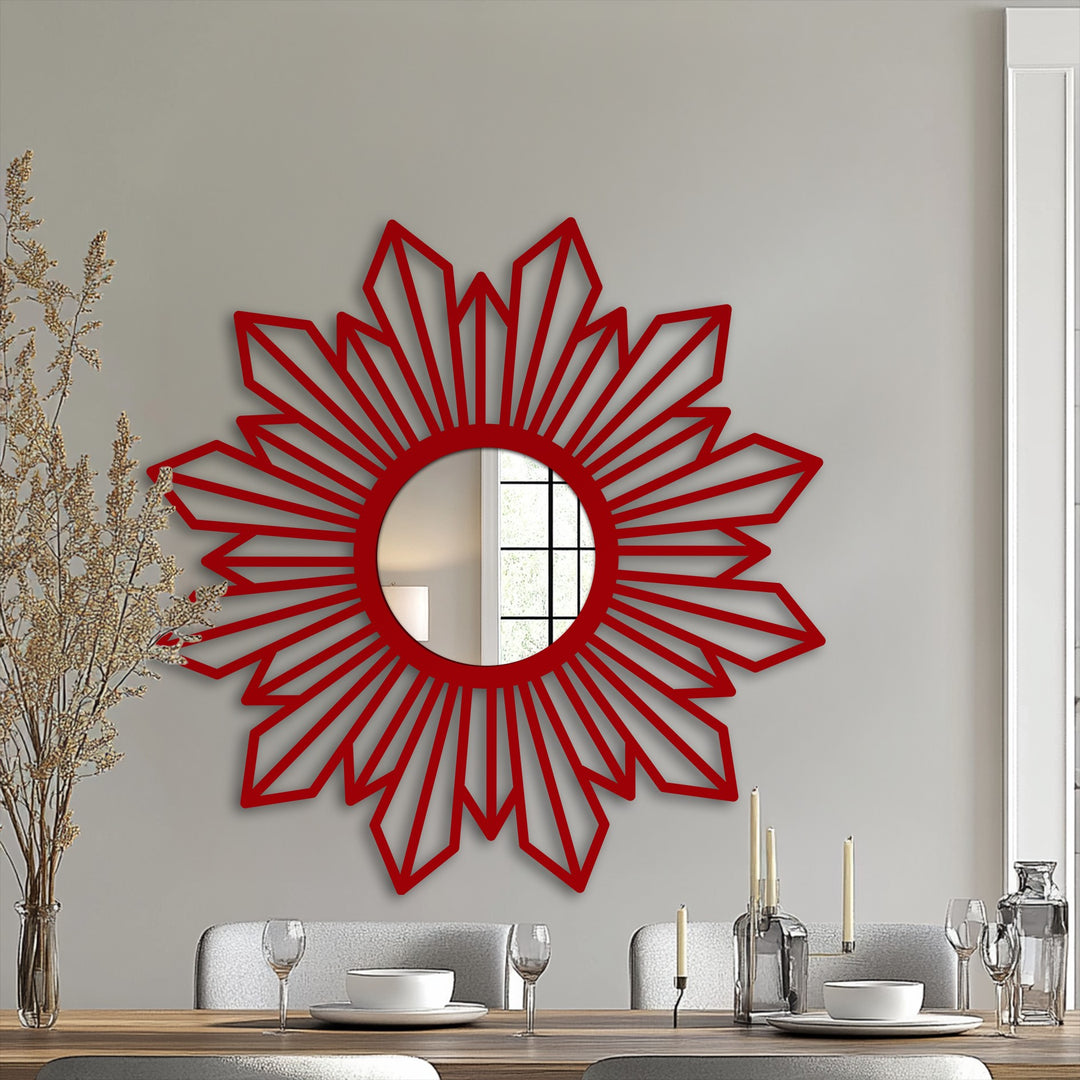 Focal point showcasing a sunburst geometric modern wall mirrors design with a radiant pattern in deep red, casting interesting shadows on the gray wall.