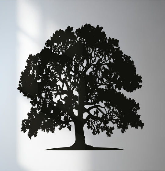 With minimal color saturation, the majestic oak tree of life metal wall decor appears as a stark silhouette against a softly graded backdrop.