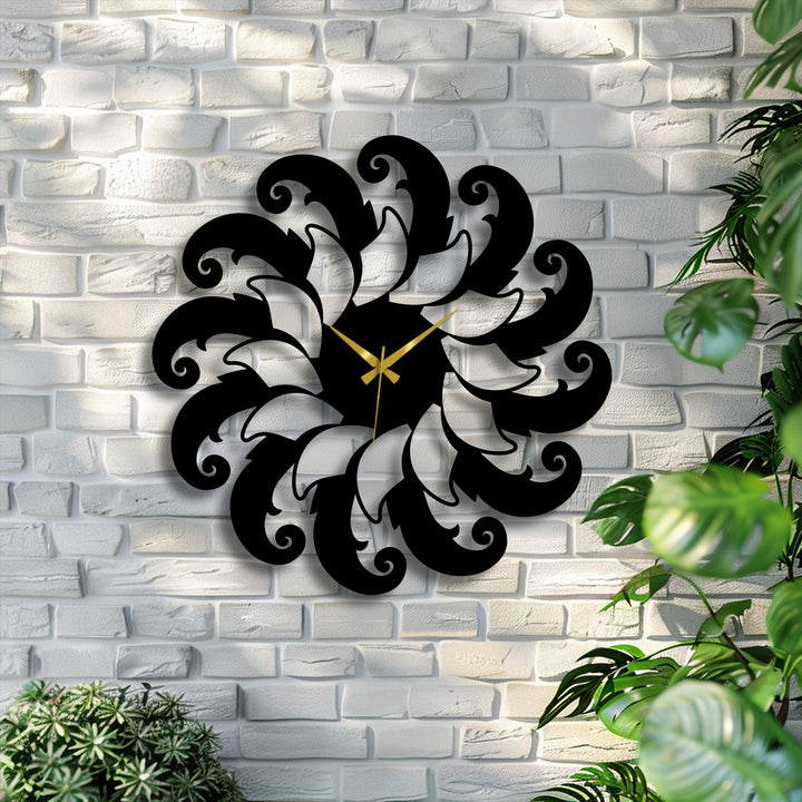 The stark color contrast of the black floral spiral metal artwork pops against the textured white brick wall, highlighted by golden clock hands.