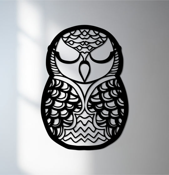 Cool color temperature highlights the subtle shadows on this minimalist owl metal art for wall, a striking piece featuring a cutout design.