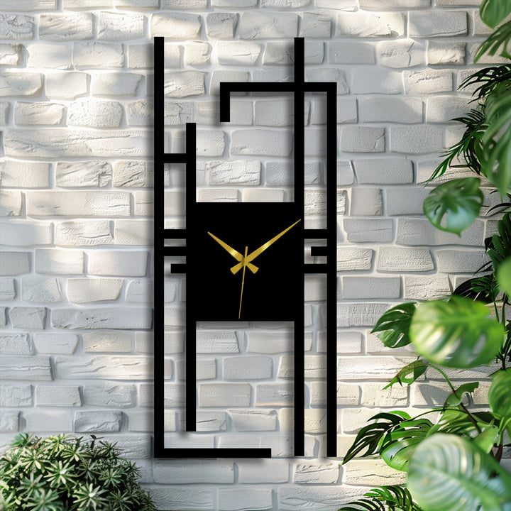Light reflections soften the sleek lines of this modern vertical abstract metal wall clock, a geometric decoration wall art piece enhancing a textured brick wall.