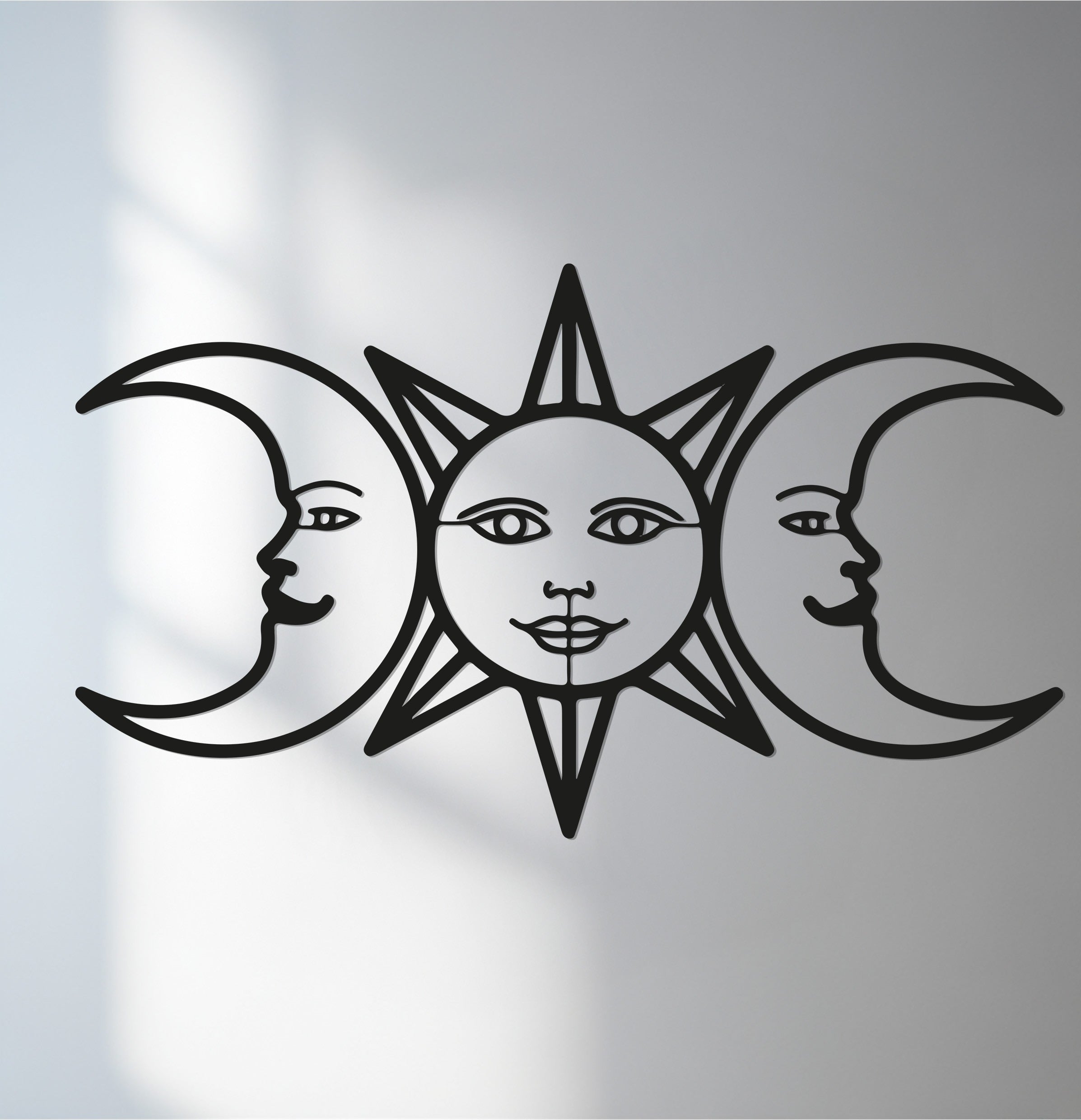 Delicate organic forms compose this sun and moon celestial silhouette metal wall decor, creating an astrological home decor that's both mystical and modern.