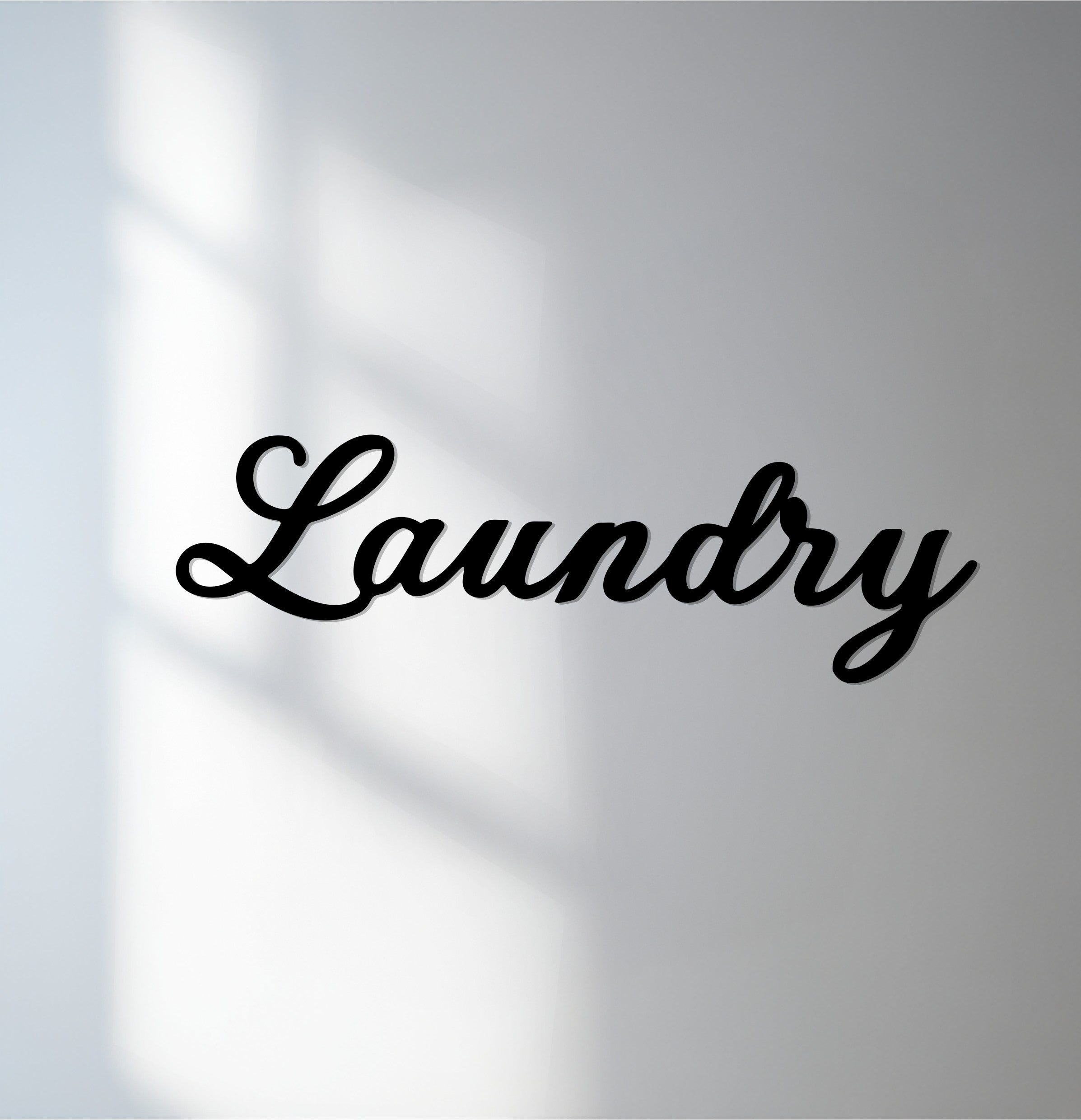 Subtle light and shadow play across this decoration wall art of the laundry script, highlighting the metal texture with a modern touch.