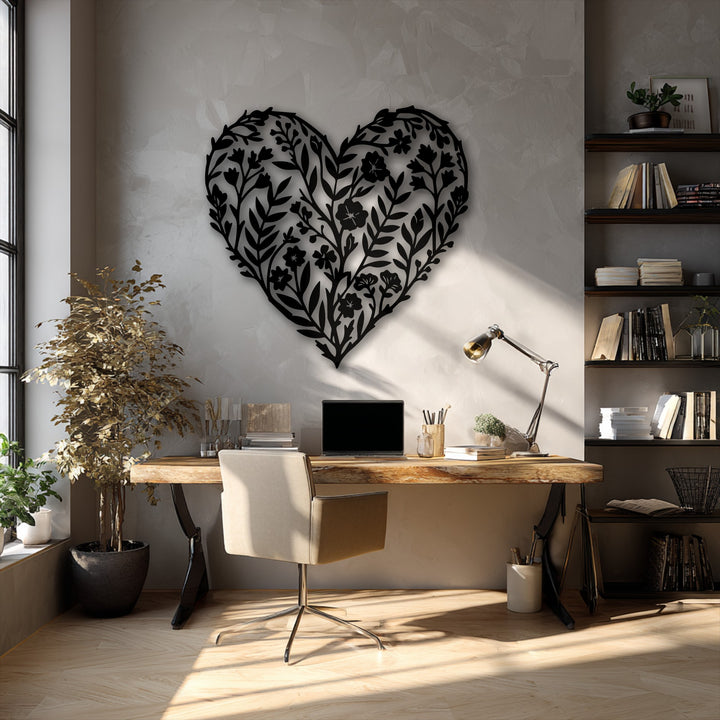 Sunlight patterns gracefully shift, highlighting the intricate botanical heart metal art for wall with a lively, moving feel.