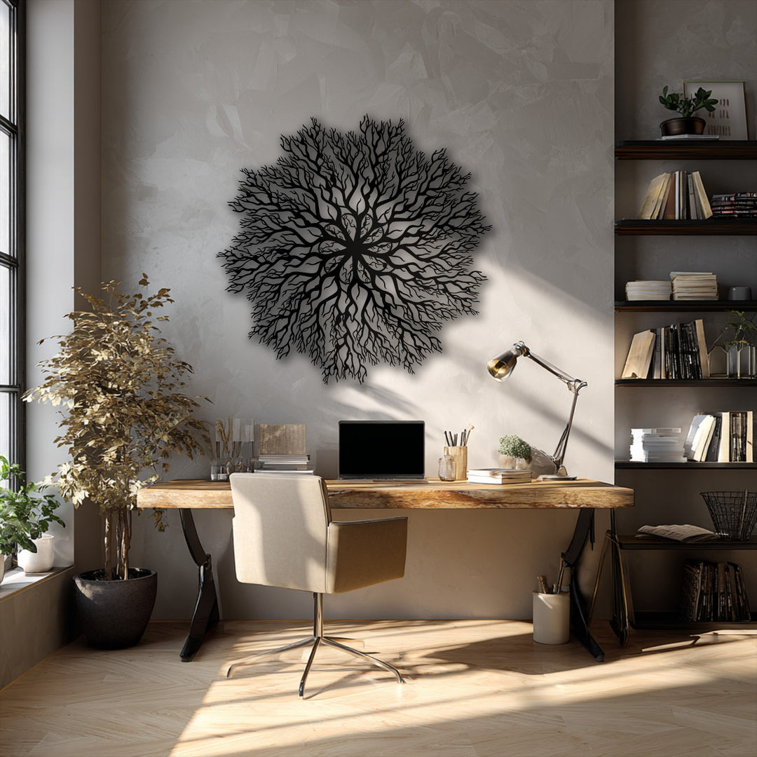 Bright sunlight illuminates the polished wooden floor and parts of the unique Tree Roots Mandala decorative metal art.