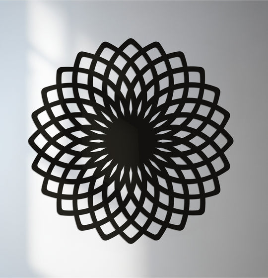 Shadows highlight the transition between colors within this decorative metal art, accentuating the modern, geometric flower mandala metal wall art design.