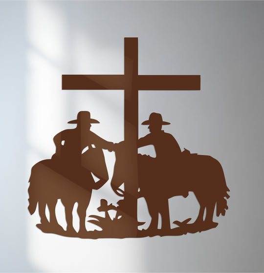 Highlighting decoration wall art, the silhouette of cowboys by a cross forms the focal point in this religious-themed metal wall decor piece.