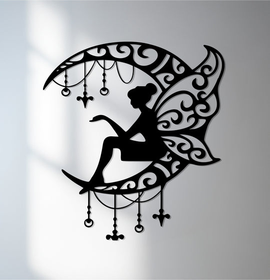 Subtle light and shadow enhance the decorative metal art of a fairy sitting on a crescent moon in this elegant moonlight fairy wall art piece.