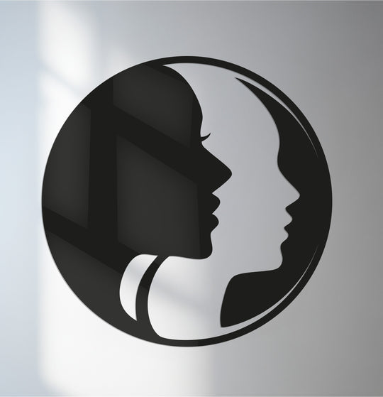 Depicting dual female faces in an interlocking profile, the focal point of this abstract metal art for wall is its bold and unique geometric form.