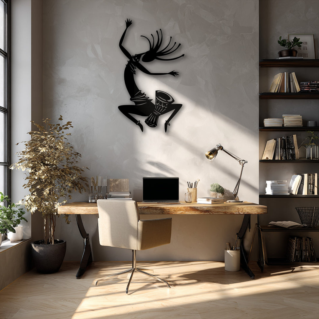 Dramatic light and shadow play across the room, highlighting the energetic tribal dance silhouette metal artwork on the textured wall.
