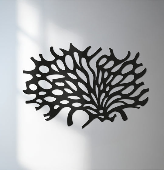 Textured decoration wall art reveals a matte black finish highlighting the organic, abstract coral design of this modern metal wall décor.